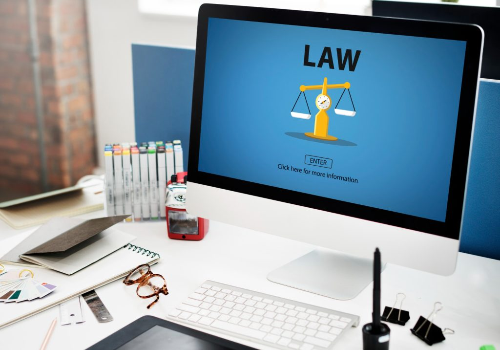 Online legal advice portal on desktop monitor representing Redbridge Solicitors digital consultations and legal services